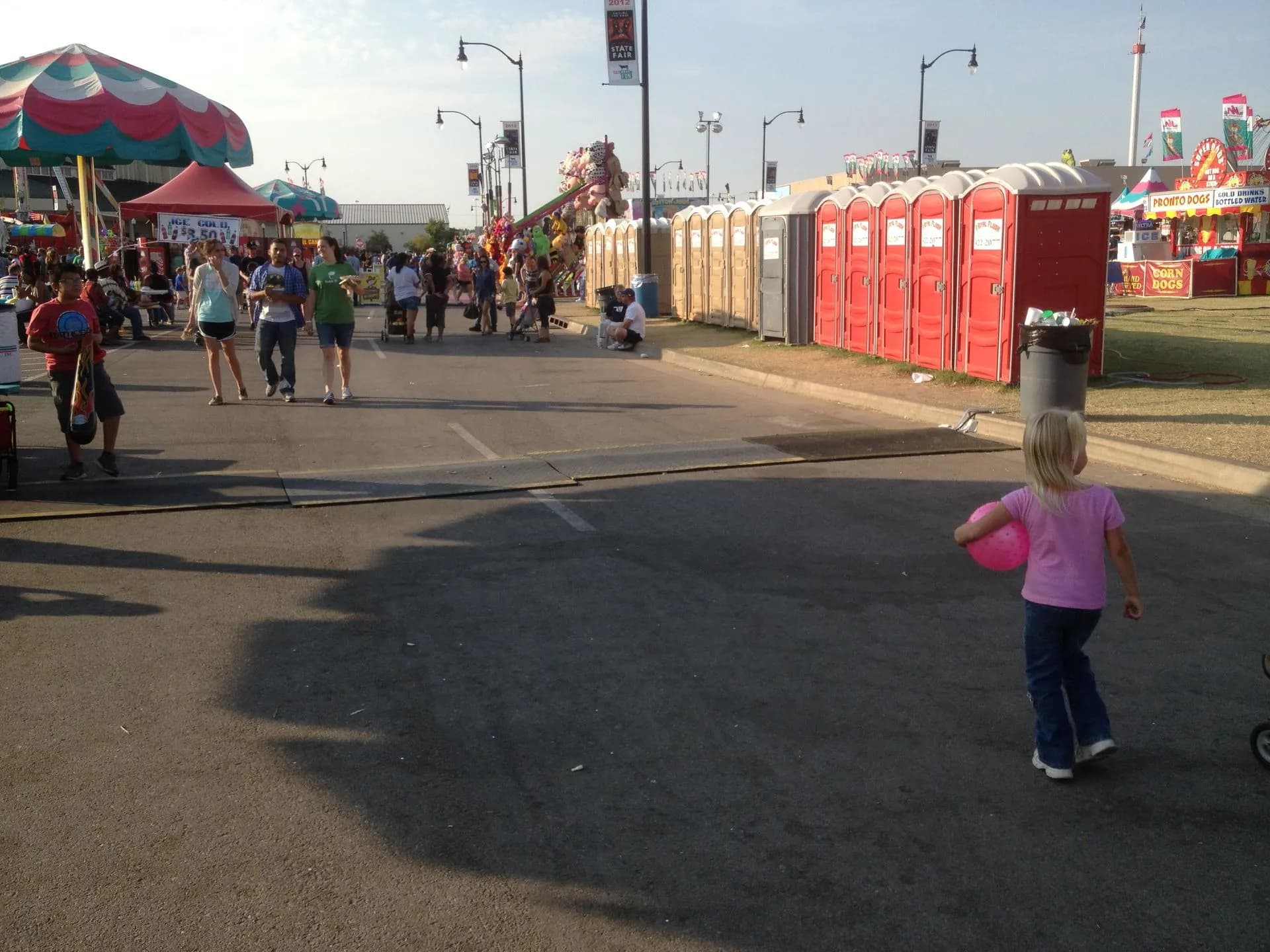 Portable restrooms along a fair midway