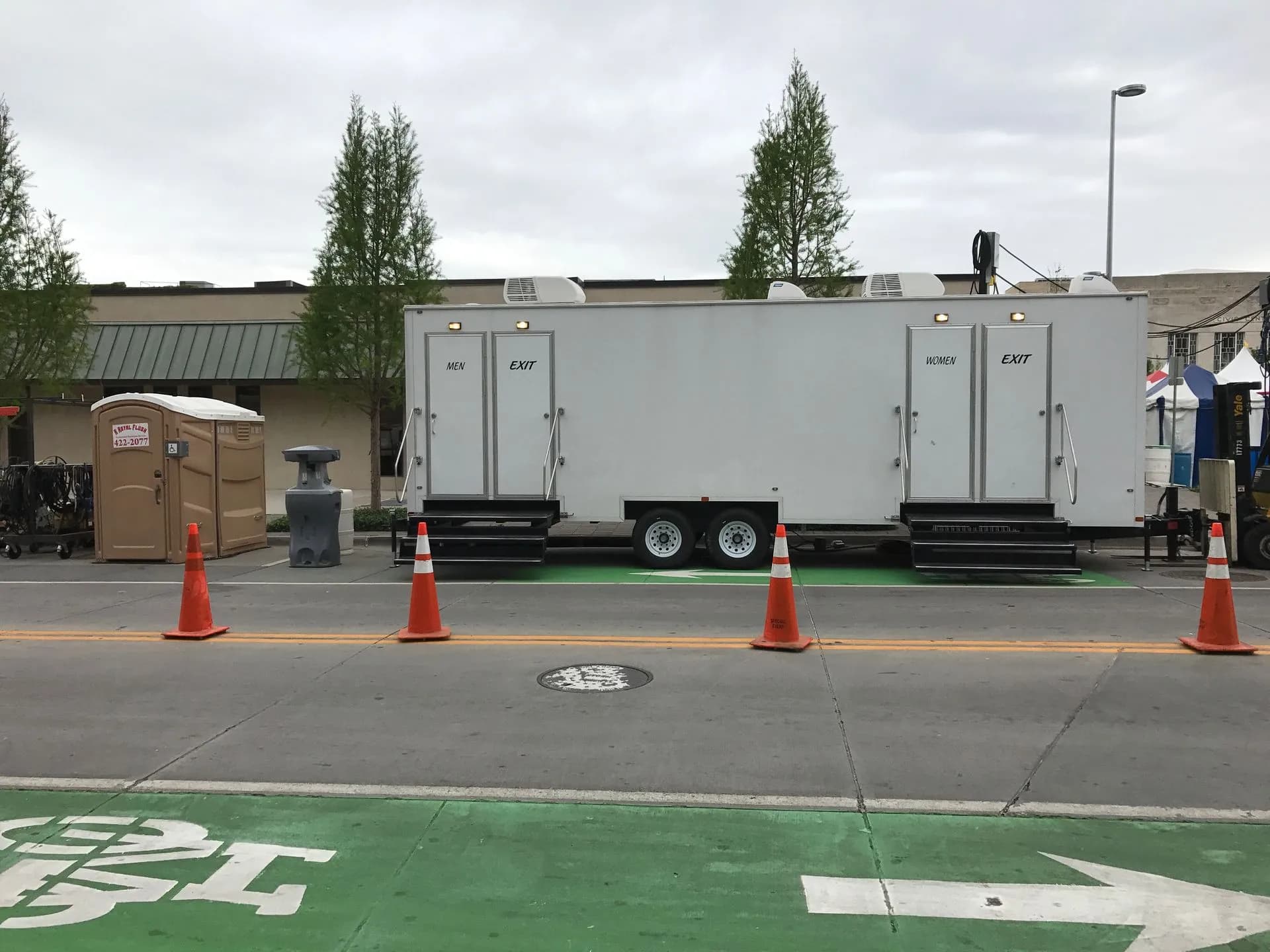 Restroom trailer set on a striped city street