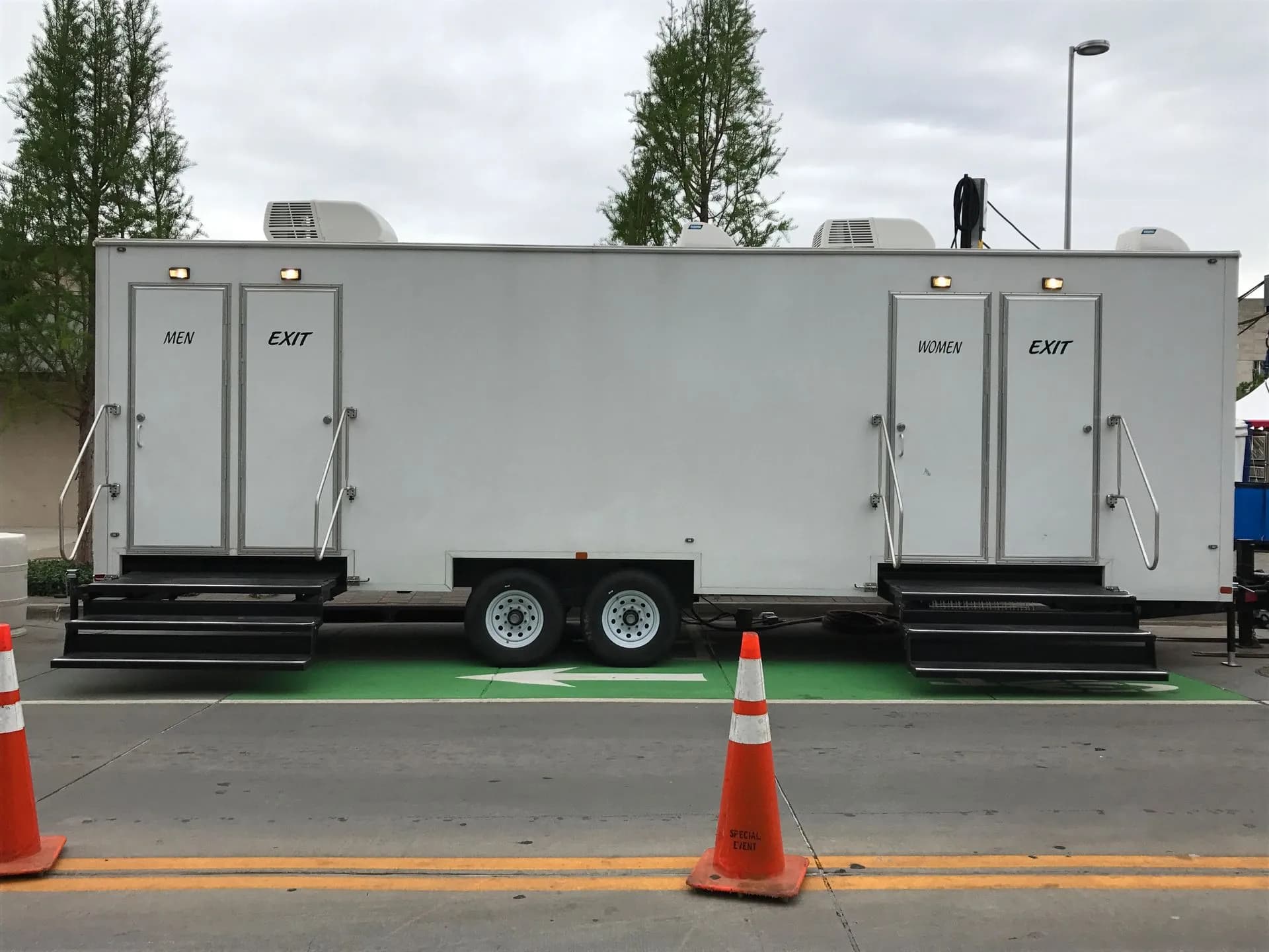 A Royal Flush VIP restroom trailer with separate men's and women's entrances
