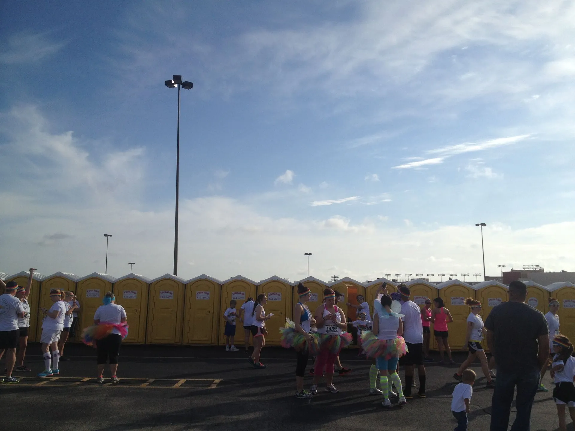 Families at an outdoor event beside A Royal Flush units