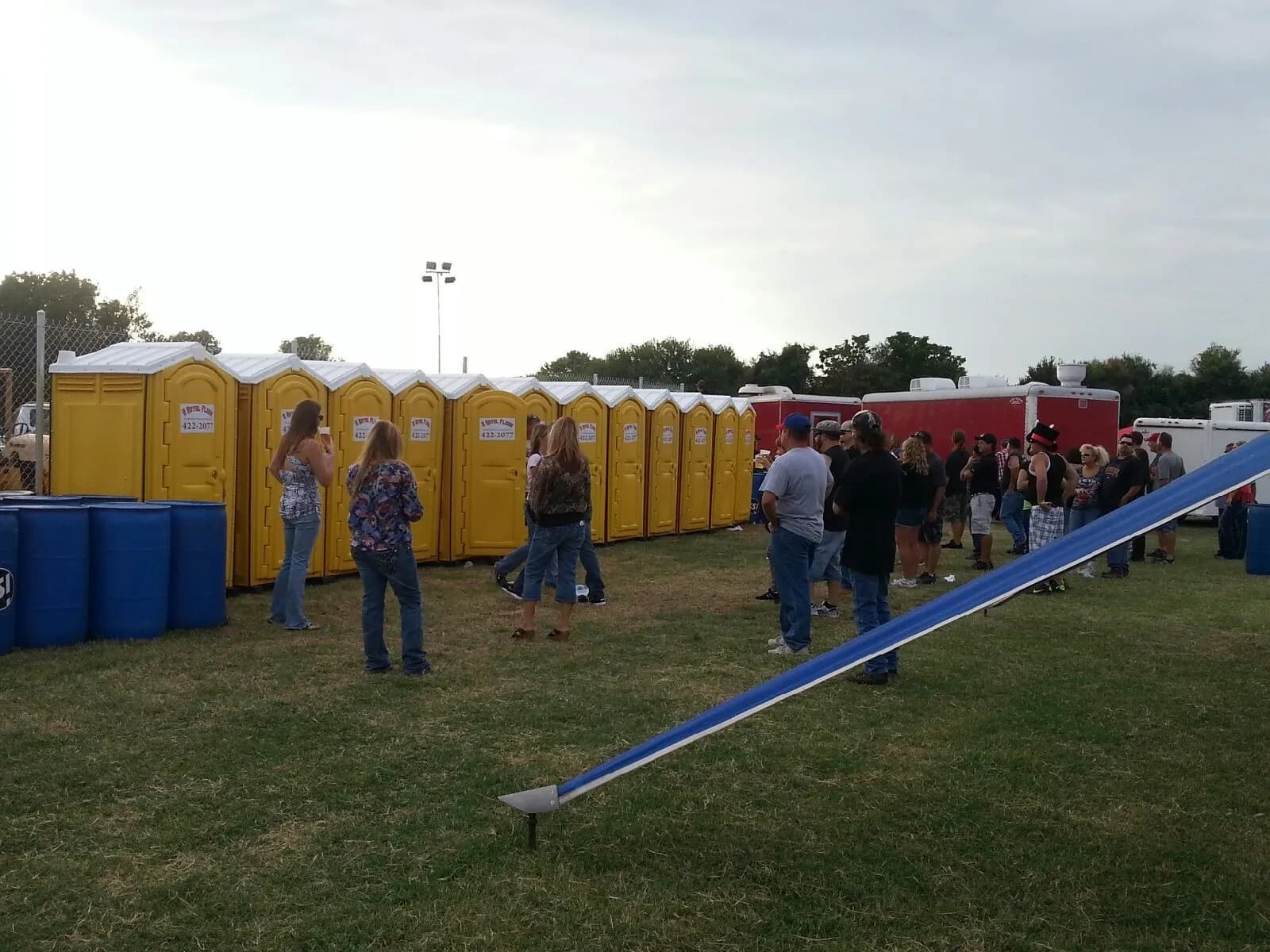 Festival crowd near portable restrooms
