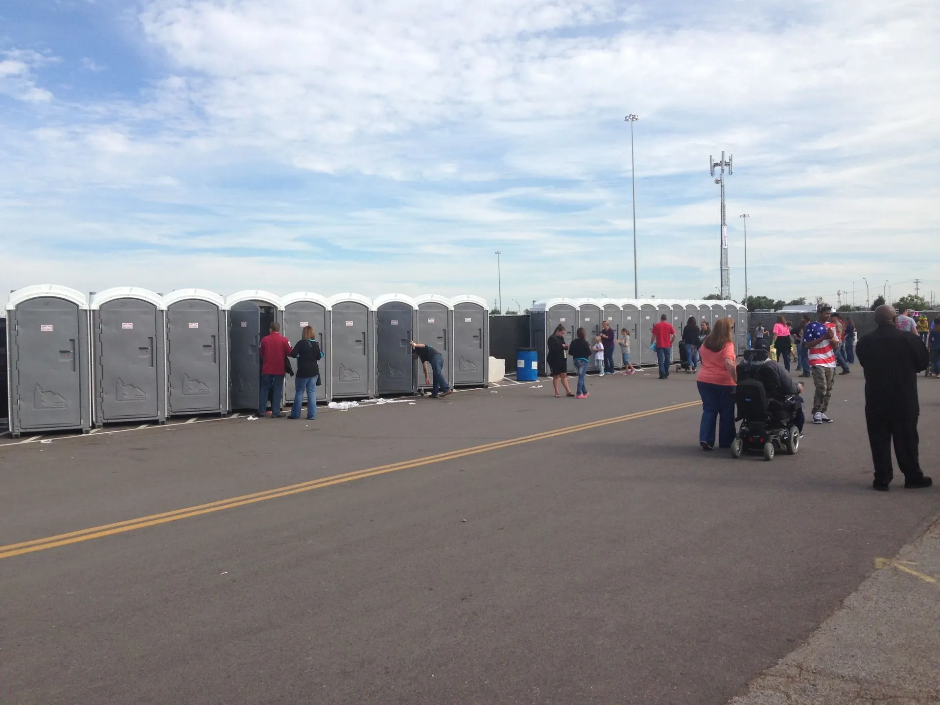 Standard portable toilets lined up along a construction site in Oklahoma City